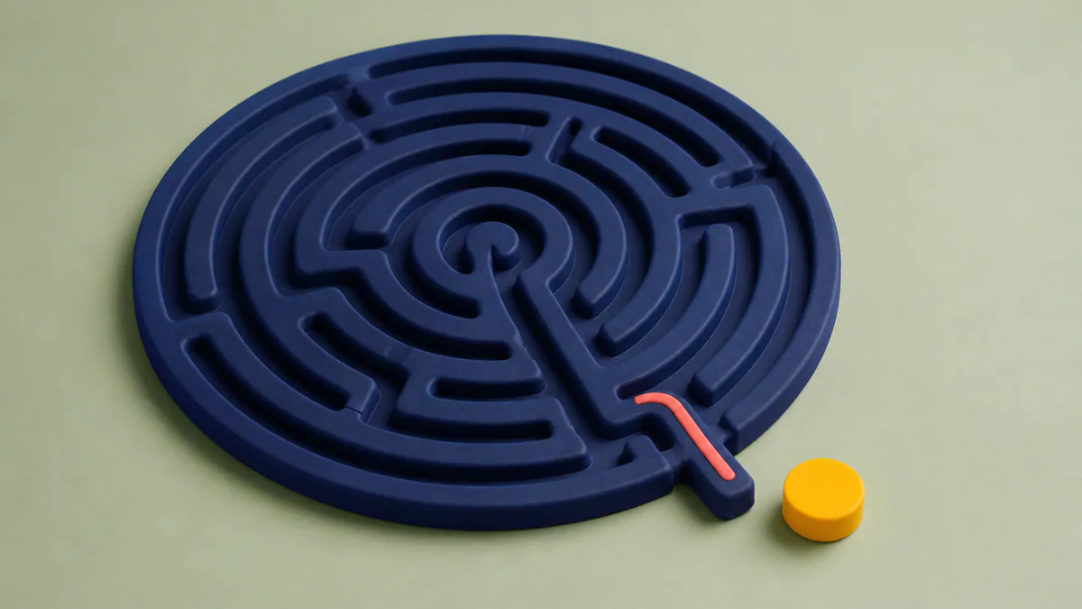 A saffron puck rests beside the open exit of a dark-indigo rubber labyrinth on a pale-sage surface.