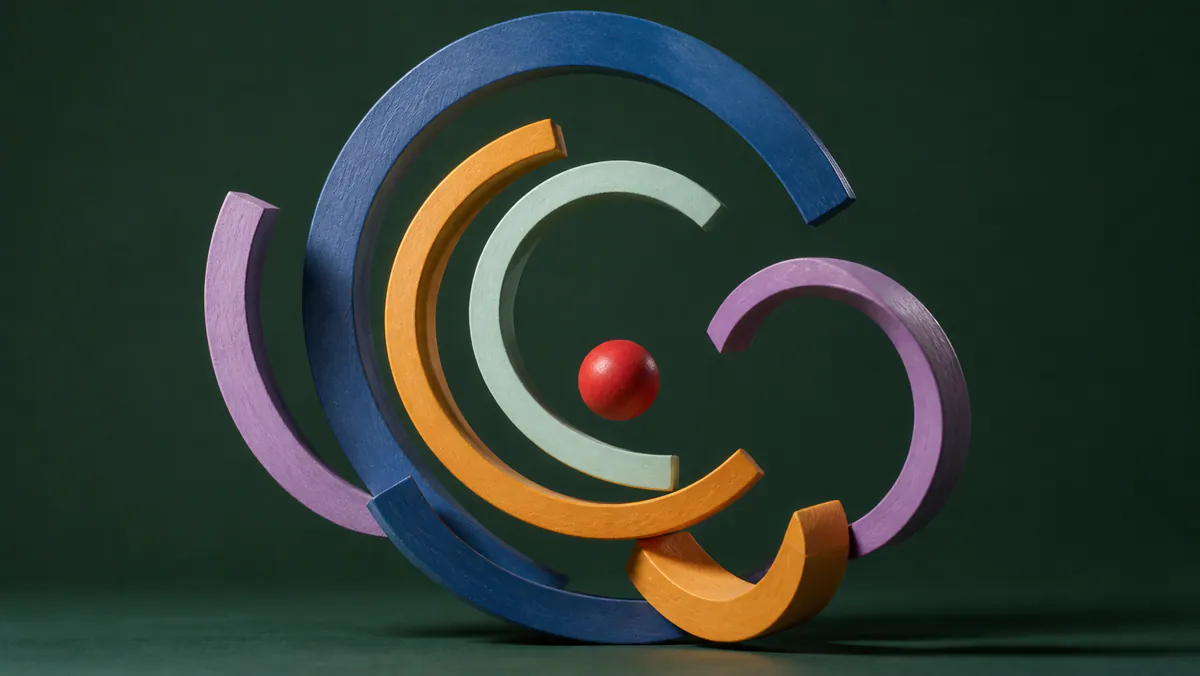 Colorful wooden arcs circle a small red sphere on a deep green studio background.